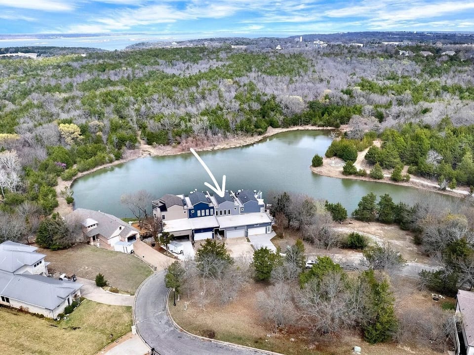 Aerial View of Four Townhomes & Private Lake