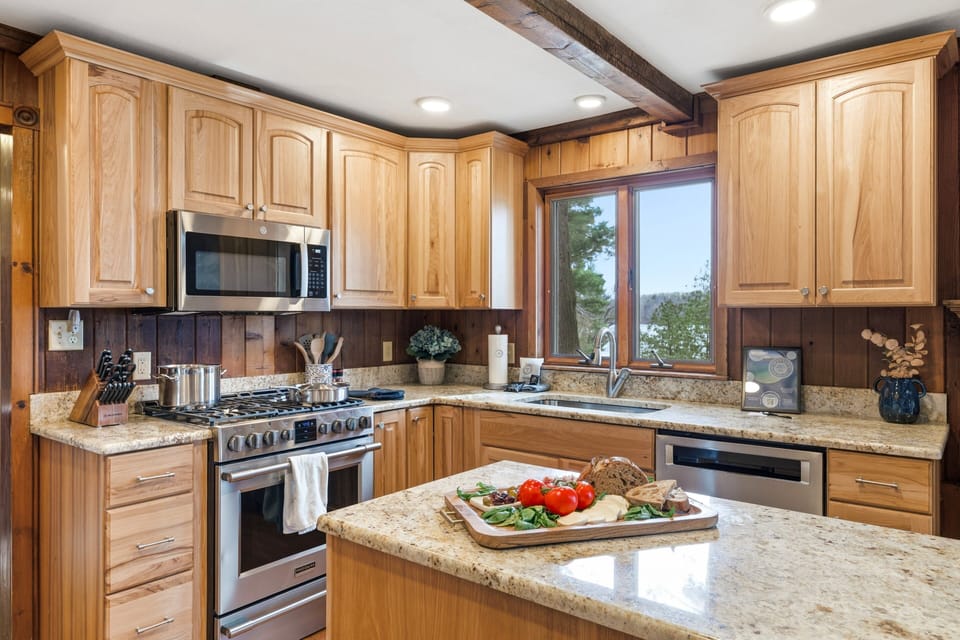 The heart of the home, offering warm wood tones, generous prep space, and timeless cottage character.