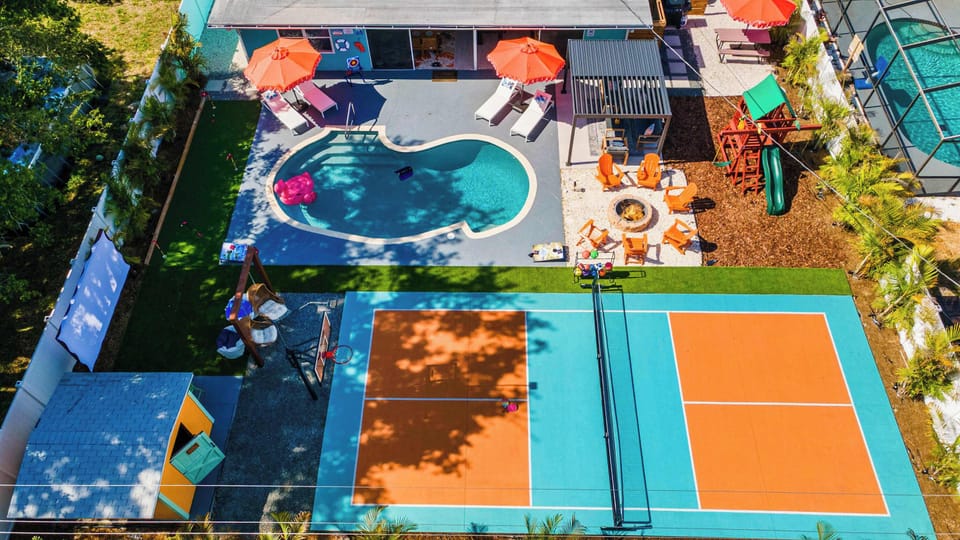 Outdoor Oasis: Dive into fun with a pool, pickleball court, and vibrant lounge spots!