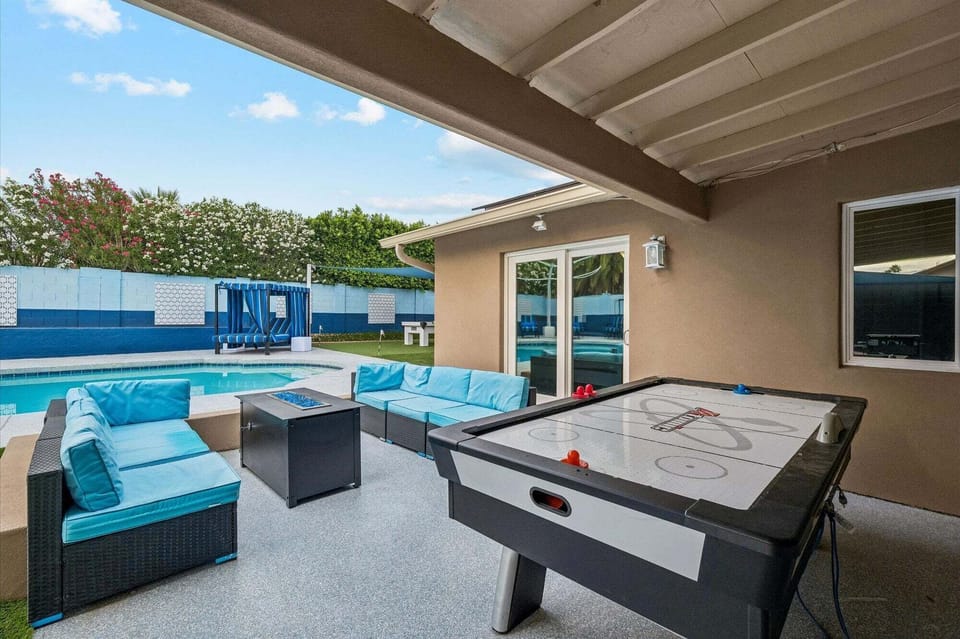 Plenty of outdoor seating, firepit, and air hockey table.