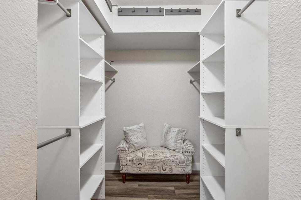 Walk-in closet located in primary bedroom.