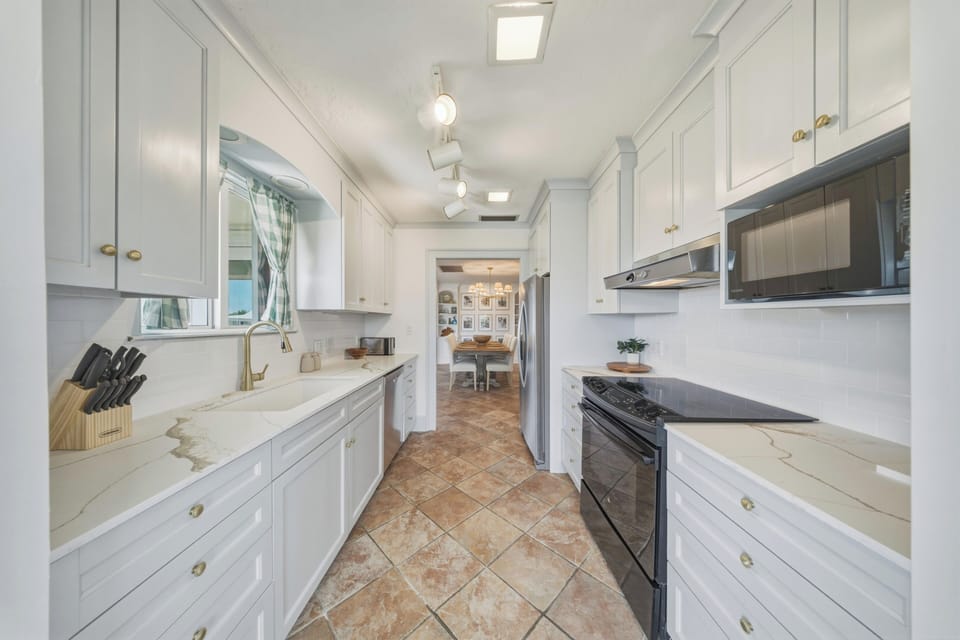 Designed for convenience and entertaining, this kitchen is perfect for preparing meals after a day at Sombrero Beach or exploring Marathon FL.