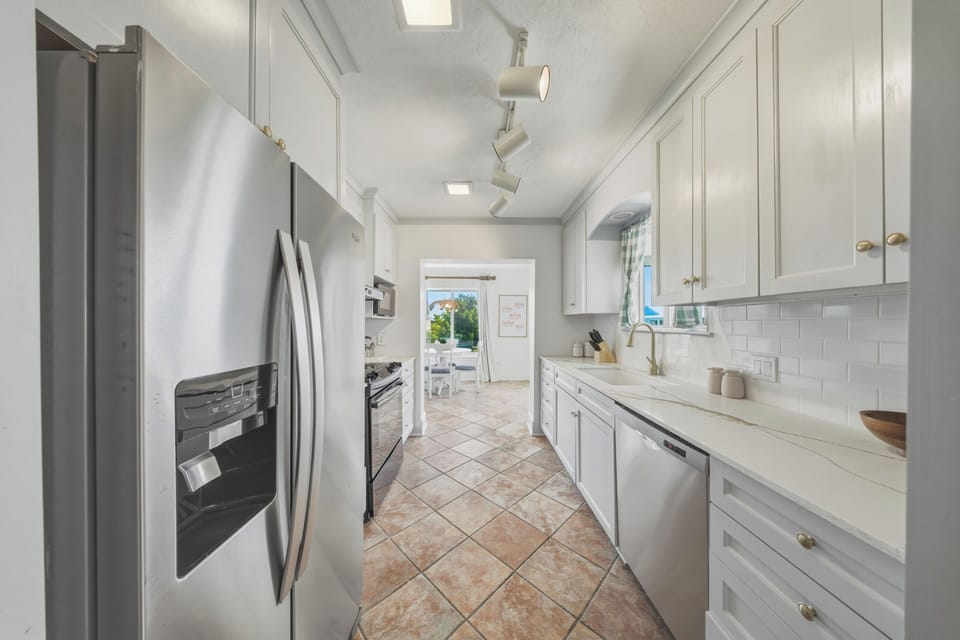 Enjoy a spacious kitchen layout with ample prep space, ideal for families and groups staying in Marathon FL.