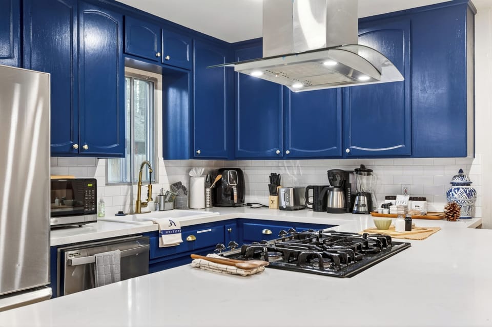 Enjoy easy meals and morning coffee in the bright dining area just steps from the fully equipped kitchen and breakfast bar.