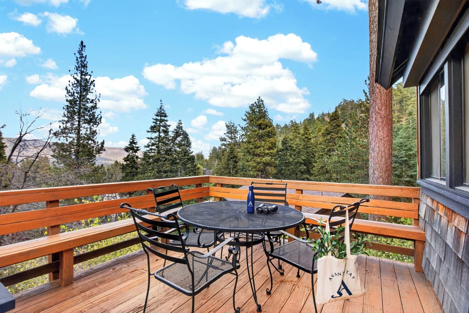 Al fresco dining area on the deck, ideal for morning coffee or sunset dinners.