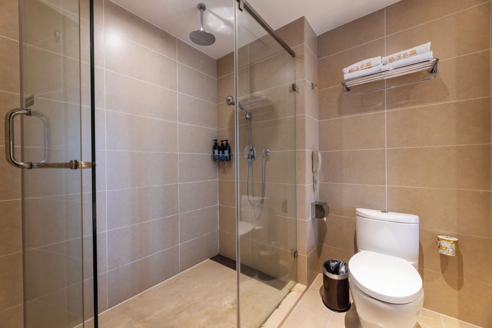 Hair dryer, slippers, towels, shampoo