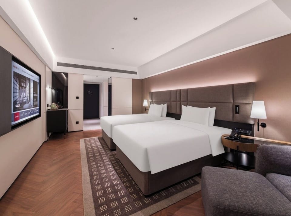 Classic Twin Room | Down comforters, free minibar, blackout drapes, iron/ironing board