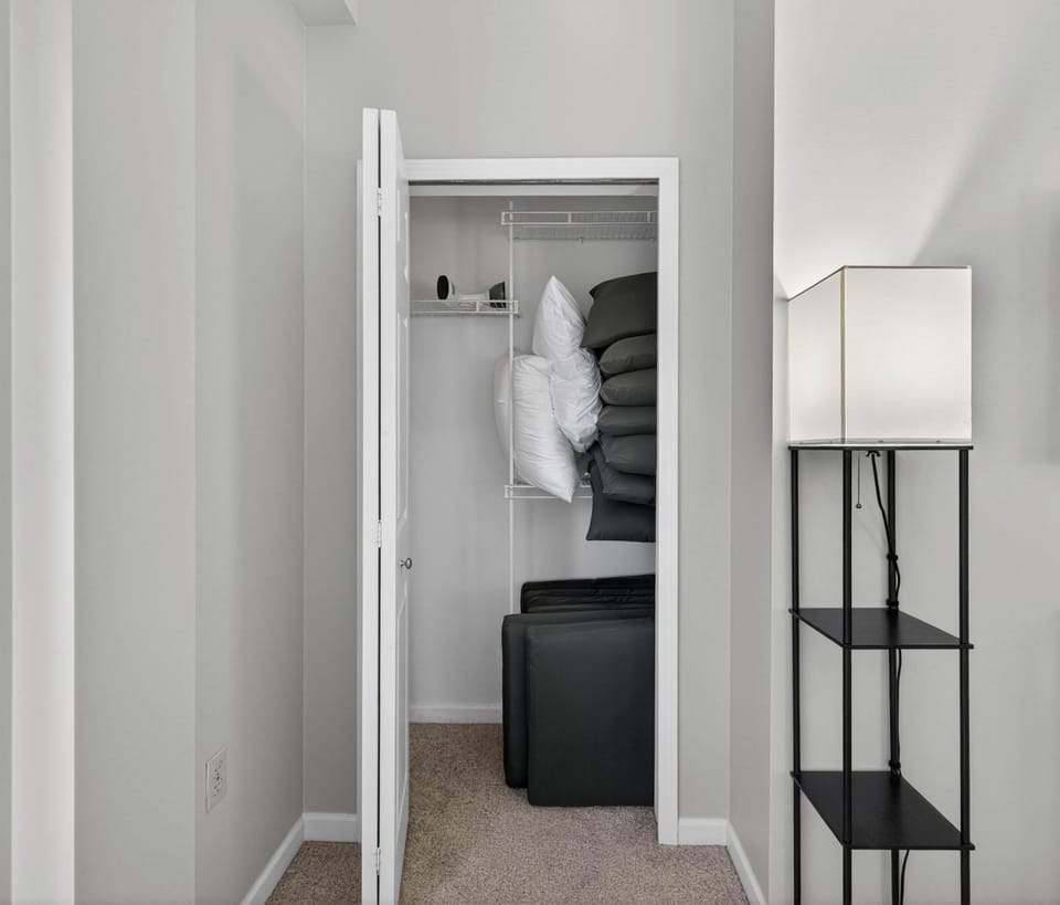 Bright hallway entry leading into the home w/ clean finishes & soft natural light