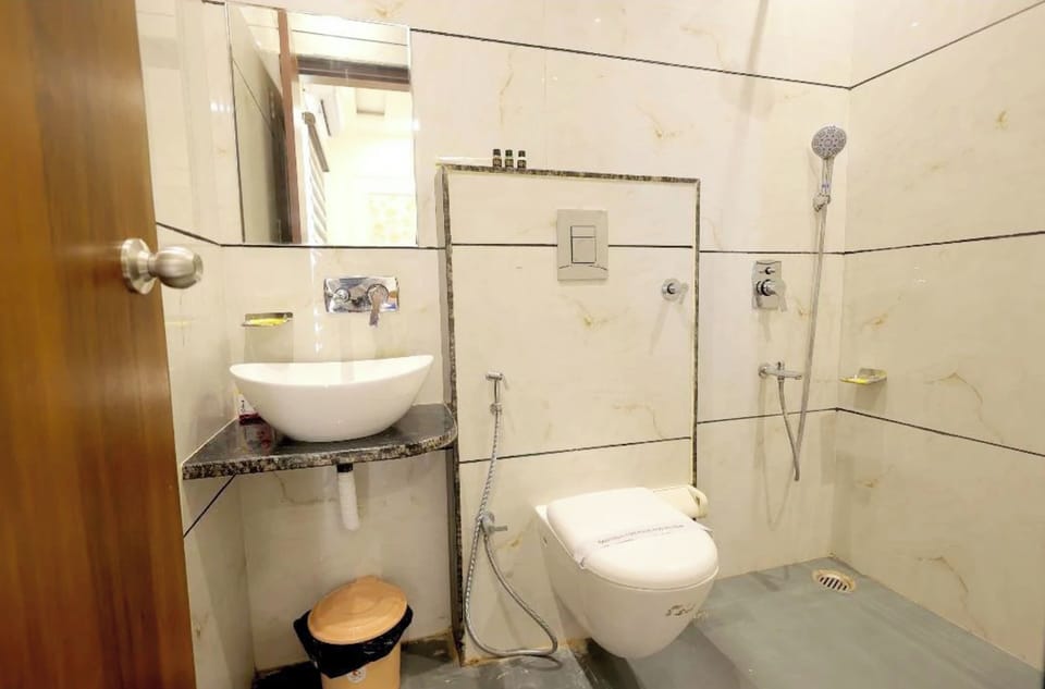 Shower, rainfall showerhead, slippers, towels