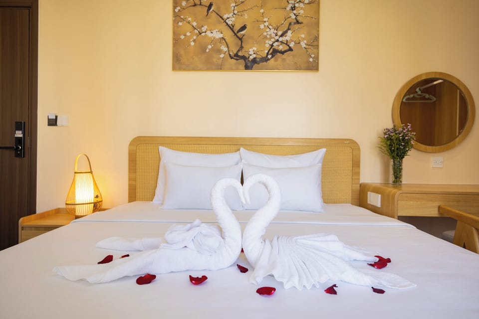 Deluxe Room, Balcony, City View | Minibar, individually decorated, laptop workspace, blackout drapes