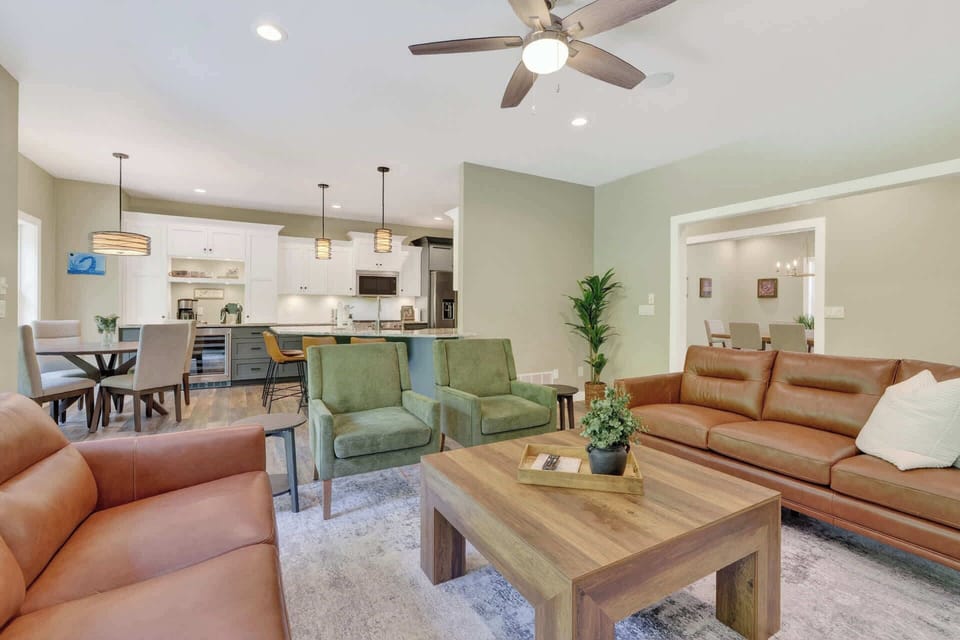 Your spacious open-concept retreat blends modern comfort with warm, earthy tones. Relax in the cozy living room, gather at the dining table, or cook in your fully equipped kitchen.