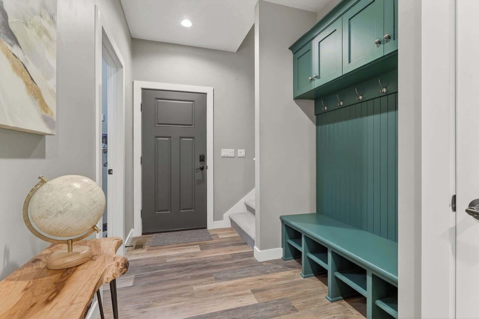 Back entrance features cubbies for shoe and coat storage