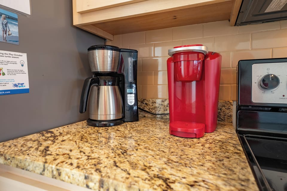 Start your mornings right with both drip coffee and single-serve options at your fingertips on beautiful granite counters.