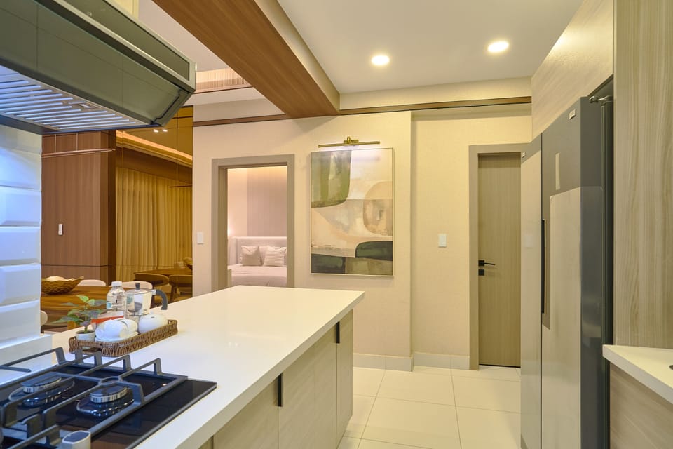 Modern kitchen with sleek appliances and a cozy dining area for intimate meals.