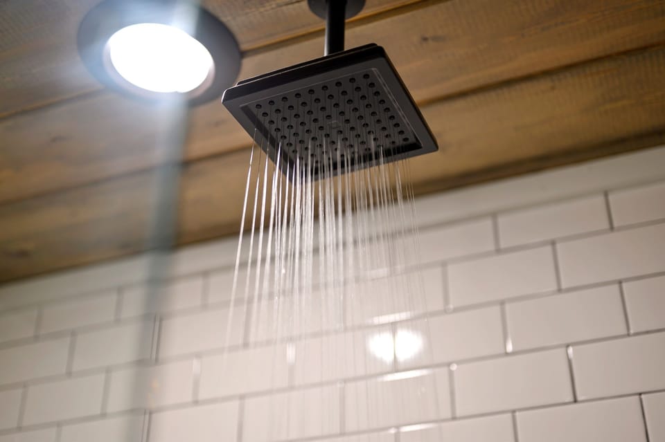 Walk-in shower, and essential amenities for a comfortable stay