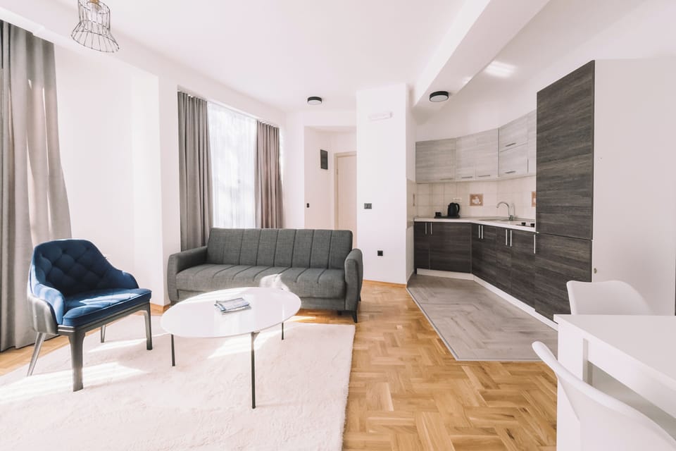 Deluxe Apartment, 1 Bedroom, Balcony, Sea View | Living area | 50-inch Smart TV with cable channels, Netflix, toys