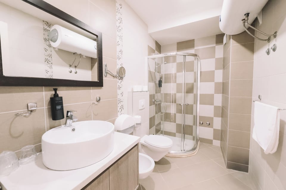 Deluxe Apartment, 1 Bedroom, Balcony, Sea View | Bathroom | Hair dryer, slippers, towels, soap