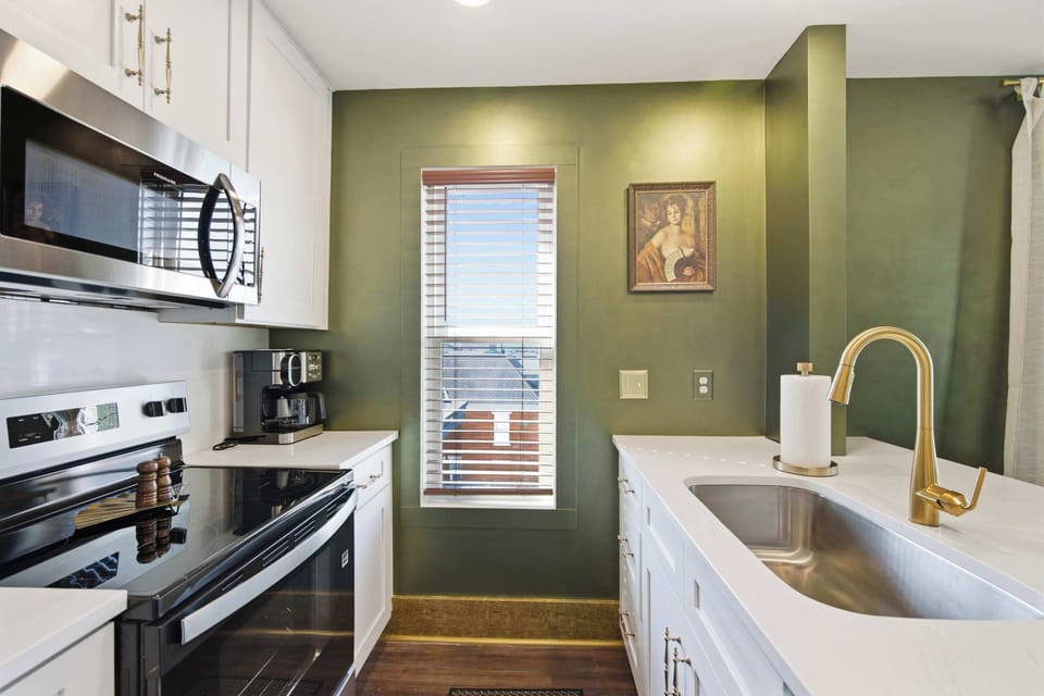 The open kitchen offers ample space & all the comforts of home​