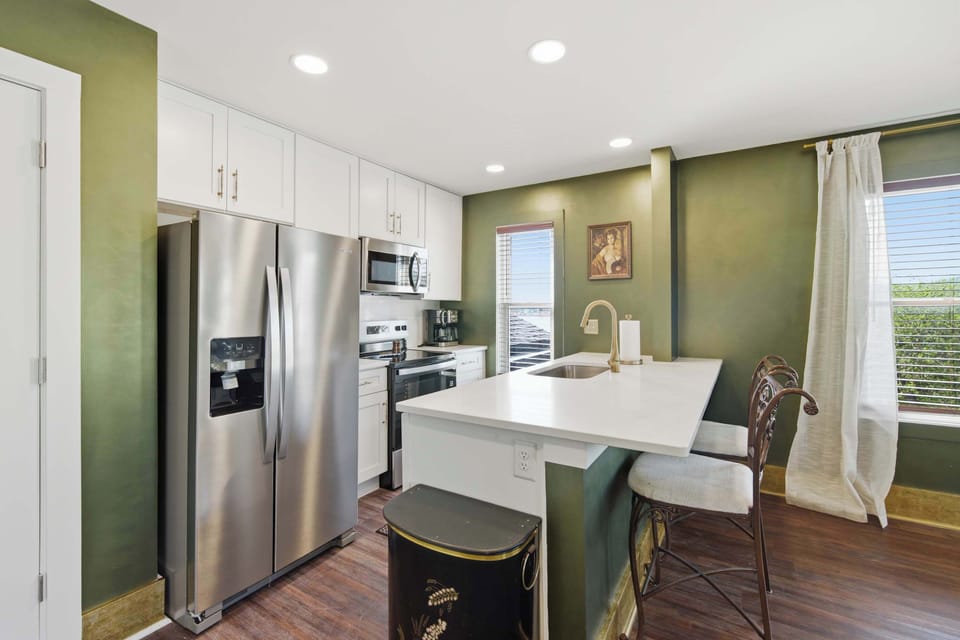 The open kitchen offers ample space & all the comforts of home​
