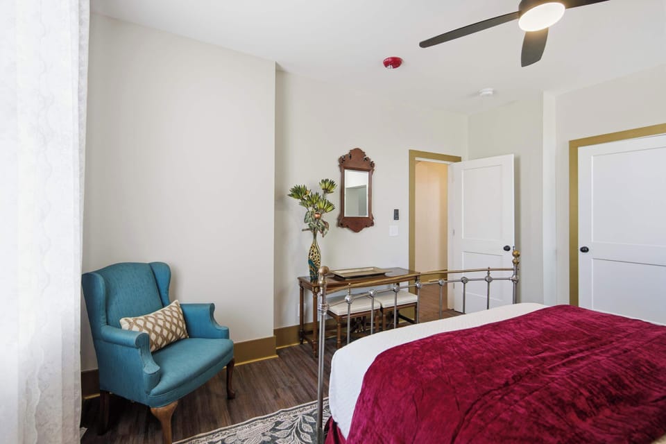 The bedroom retreat features a plush queen-sized bed​