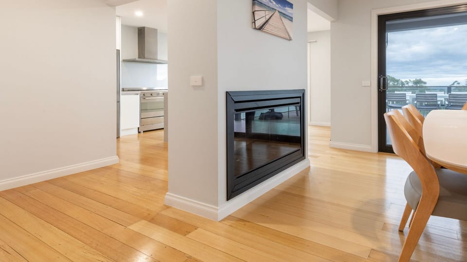 Dining area with gas fireplace and large windows