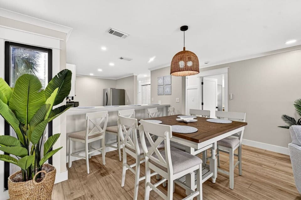 Dining area with seating for the whole group and convenient breakfast bar access.