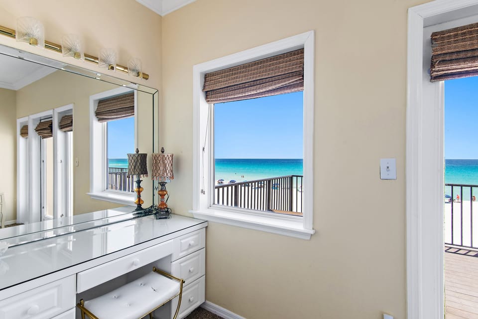 SPACIOUS Master Bedroom features a King Bed, Workspace, and BIG Gulf Views off of the 3rd Floor Private Balcony
