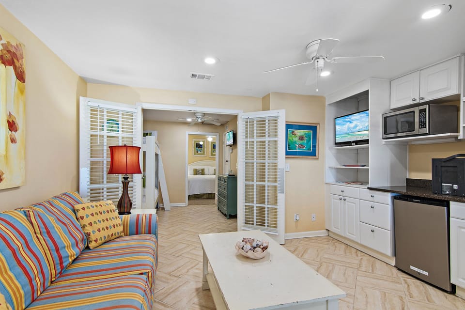 The 1st Floor features another Living Room with a Smart TV, Multi-, a Kitchenette, and Patio Access - Great for the Kids!
