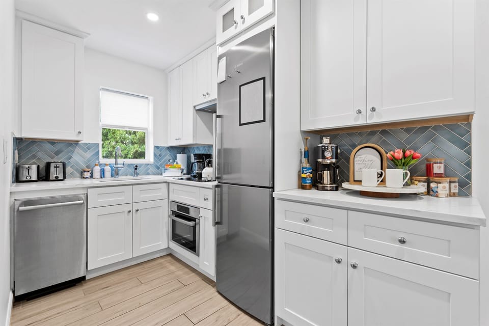 Fully stocked modern kitchenette with sleek finishes and everything needed for your stay.
