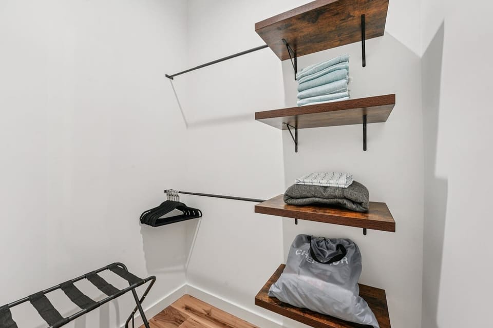 Suitcase holder, air mattress, and beach towels located here