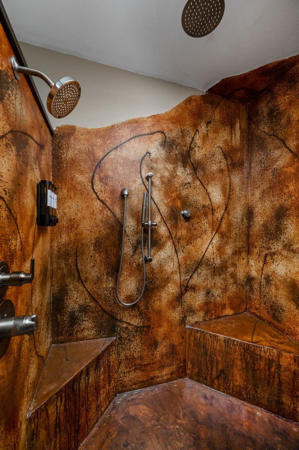Ahhhh, nothing like a hot shower after a long day! Take a nice hot shower in the custom-built shower, featuring seating and a nice rainfall shower head! 