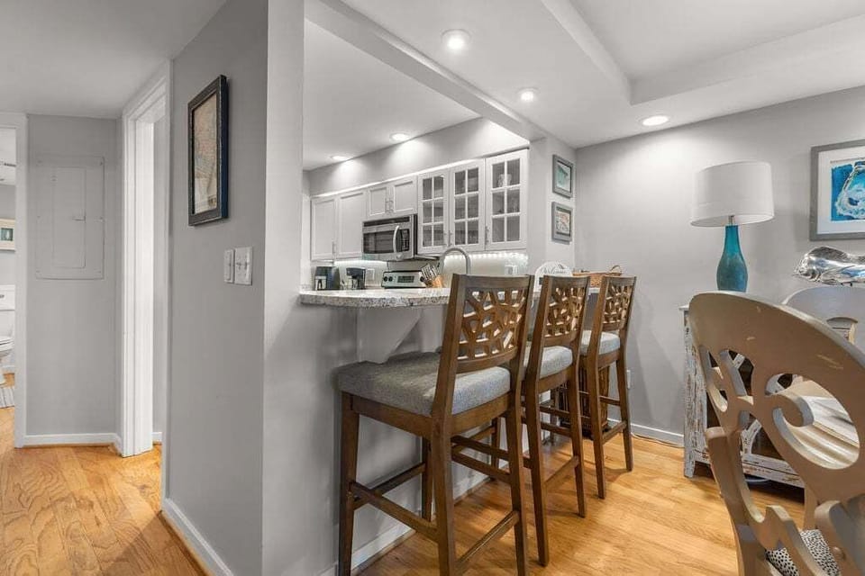 Eat in kitchen at the counter for three.