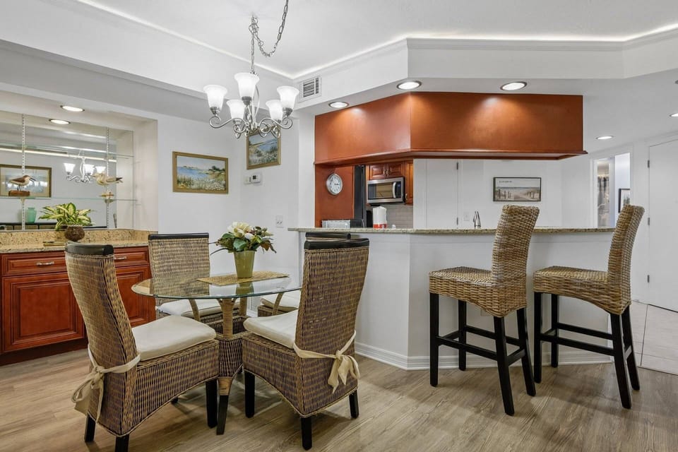 Coastal-inspired dining space with comfortable seating for four