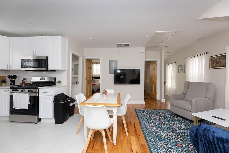 Bright open-plan kitchen, dining & living space with warm natural light