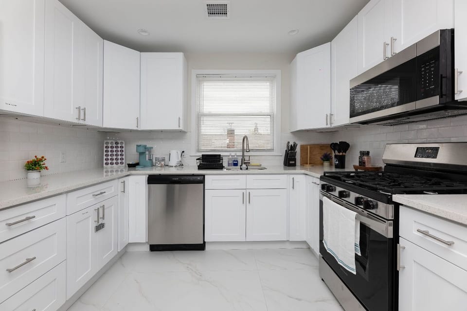 Bright modern kitchen with stainless steel appliances and ample counter space