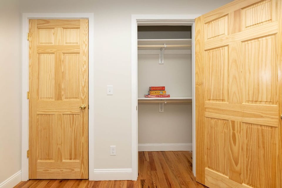 Bright room with hardwood floors and spacious closet storage