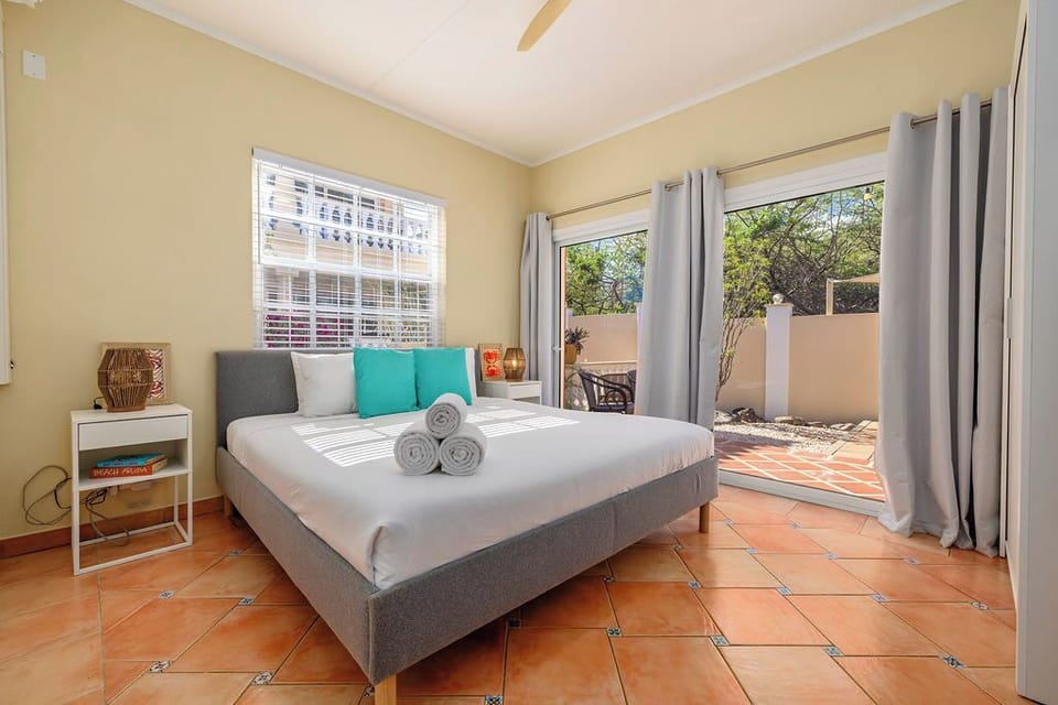 Spacious bedroom offering comfort and privacy, ideal for recharging after a day of island adventures