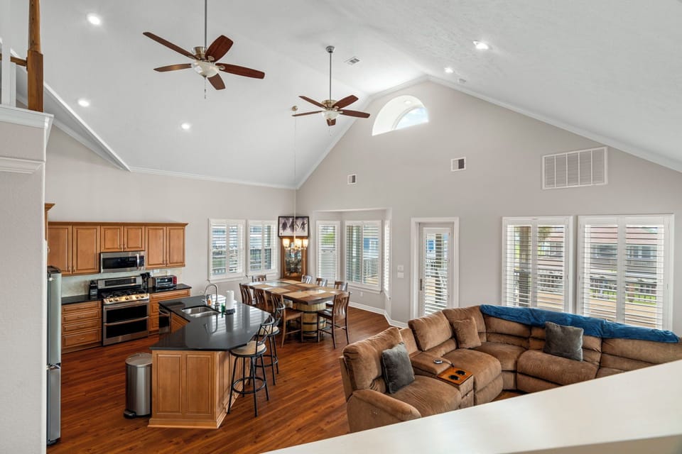 Enjoy effortless group gatherings in this expansive open-concept space with vaulted ceilings, a large dining area, and a fully equipped kitchen.