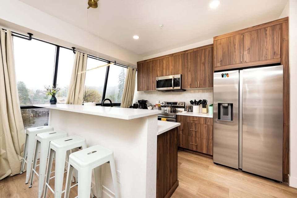 Eat your favorite foods at this breakfast bar and open kitchen with beautiful views of the town and mountains.