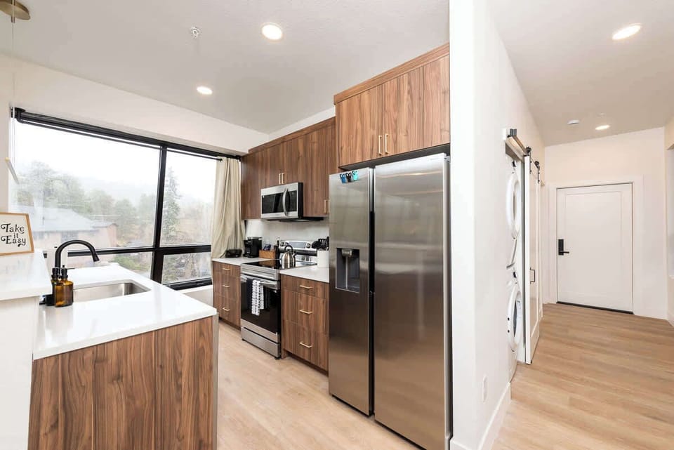 Modern upgrades and stainless steel appliances make this space appealing.