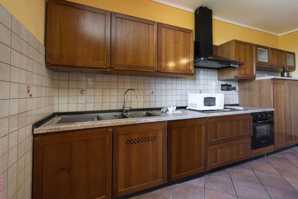 Kitchen, Countertop, Kitchen Appliance, Cabinetry, Major Appliance, Wood, Flooring, Kitchen Sink, Interior Design, Floor