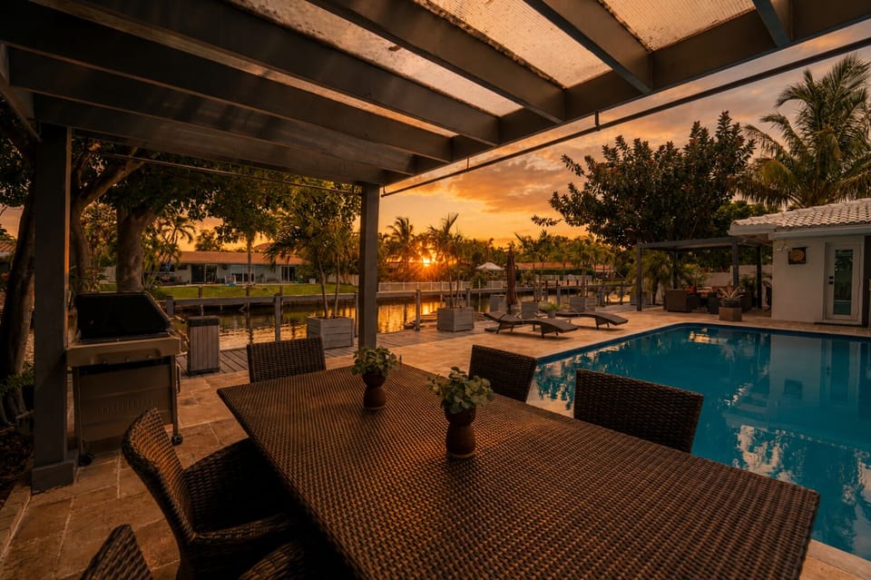 Waterfront outdoor oasis with lounge seating