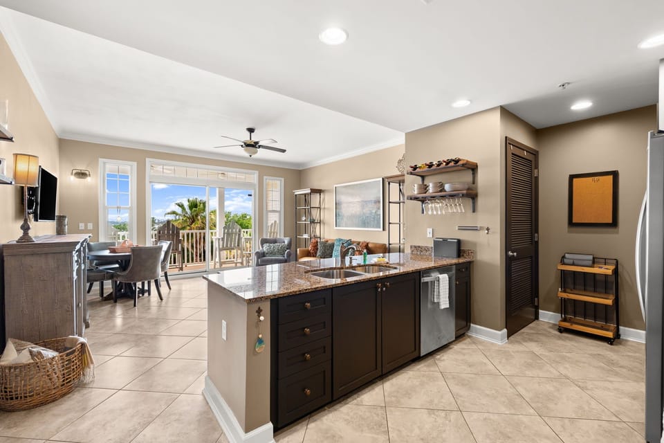 The fully equipped kitchen features granite countertops, stainless-steel appliances, and has everything you need to prepare meals for family & friends.