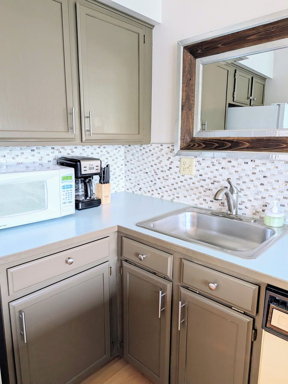 A full service kitchen stocked with essential pots, pans, plates, and more!
