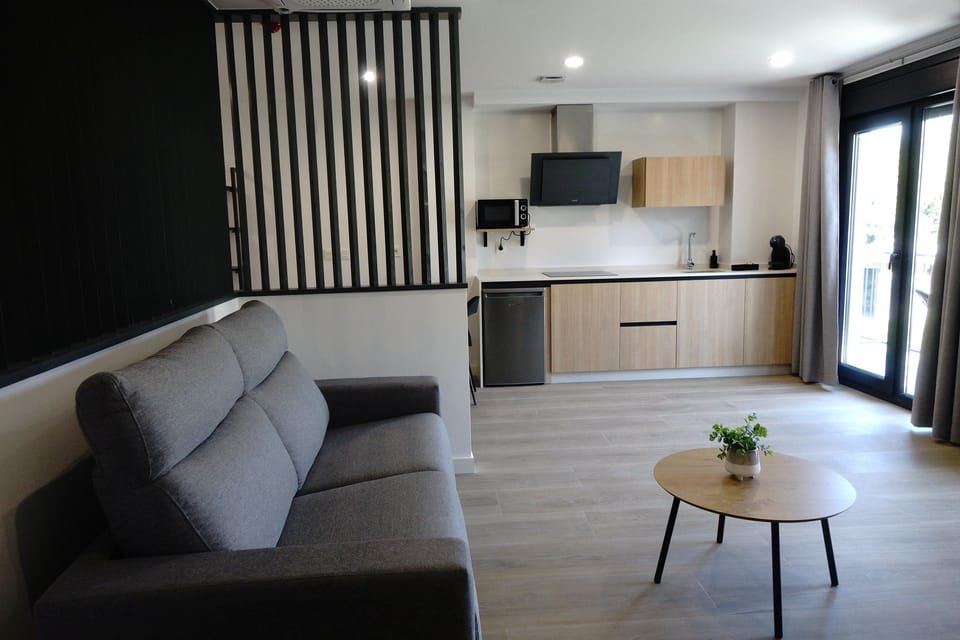 Condo, Balcony | Living area | 52-inch Smart TV with digital channels