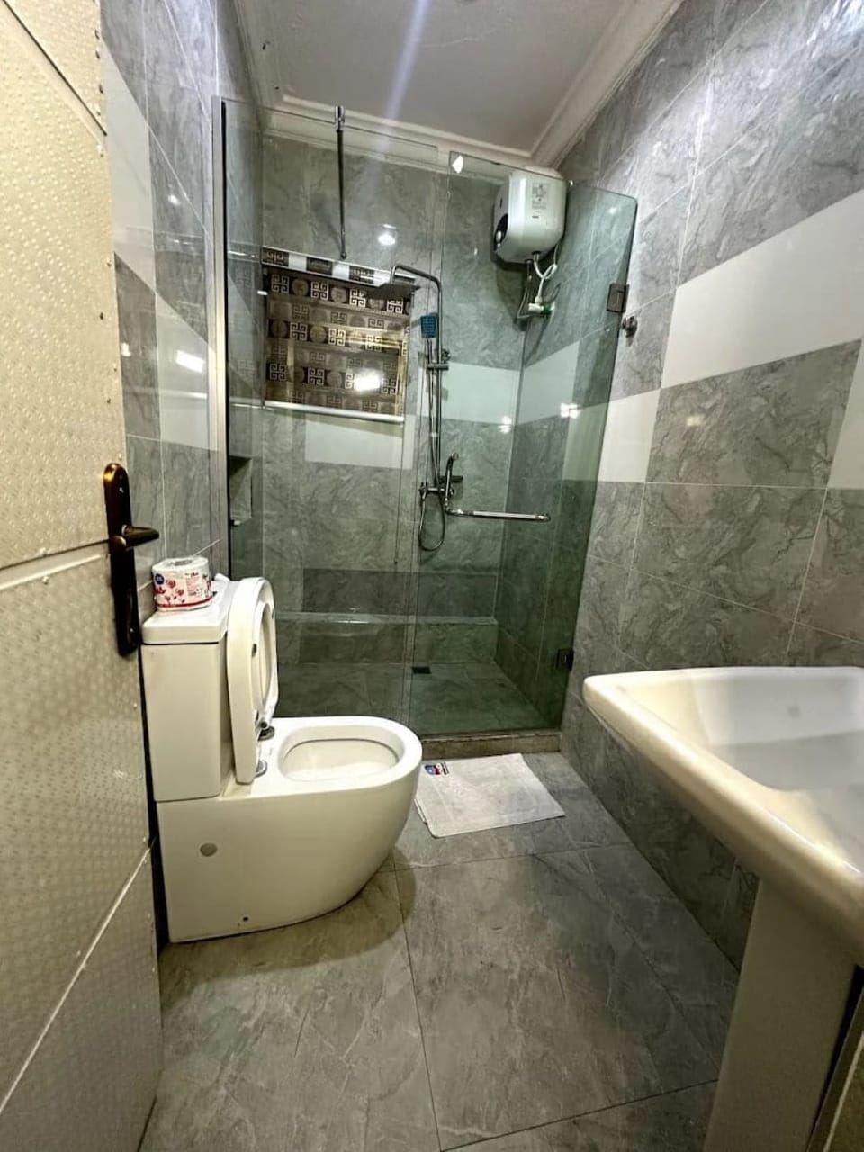 Shower, towels, soap, toilet paper
