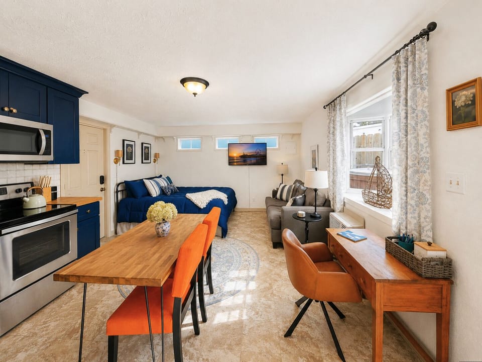 Light-filled open layout with large kitchen/dining space and bay window