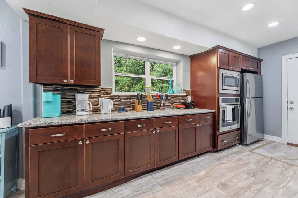 Spacious kitchen with ample cabinetry and modern appliances, perfect for cooking and entertaining.