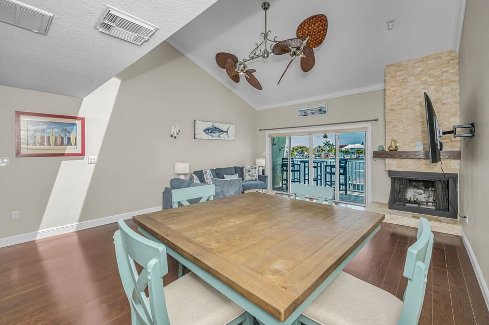 Dining and living area with fireplace