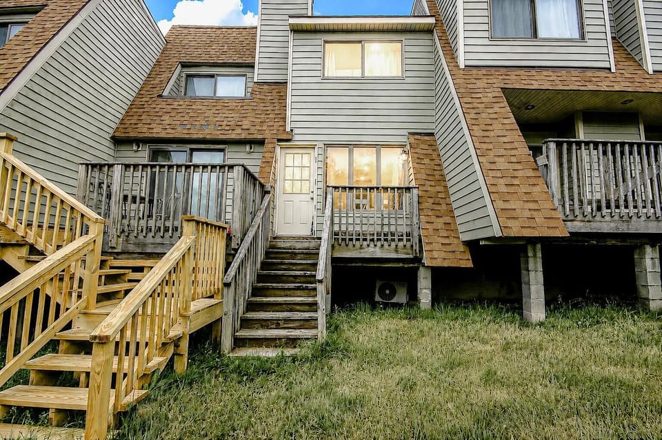 Exterior stairs on the back of the property. Shamrock 27A is the center unit in the photo.